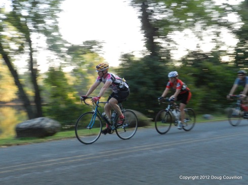 photograph of cyclists riding near the James River