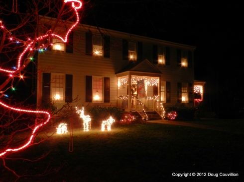 photograph of a house decorated with Christmas lights