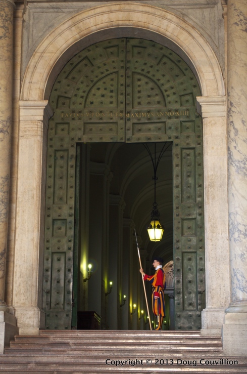 photograph of a guard at the Vatican standing in a door way